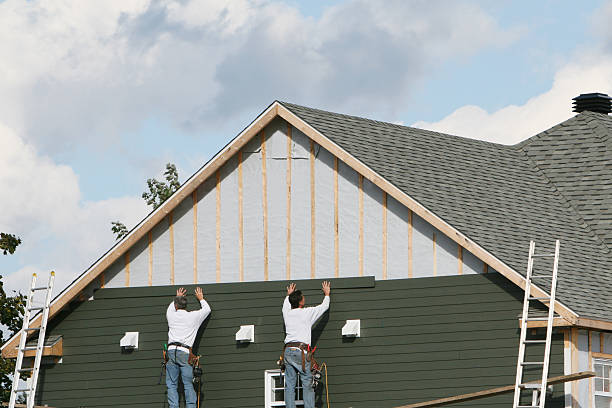 Professional Vinyl Siding technician working in Luxor, PA